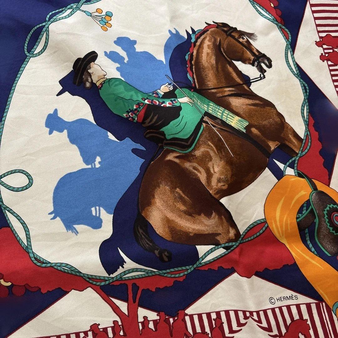 エルメスのシルクのスカーフです。 馬と騎手デザインです。