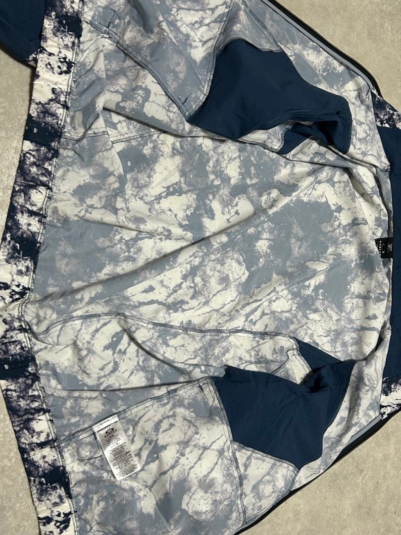 極美品 OAKLEY ENHANCE GRAPHIC WIND L 総柄 メンズ