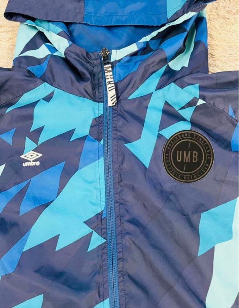UMB ピステ・ウィンドブレーカー 青・水色