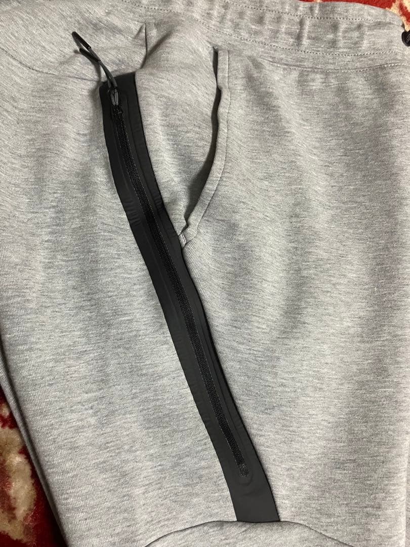ナイキテックフリースグレー サイズMボトムス