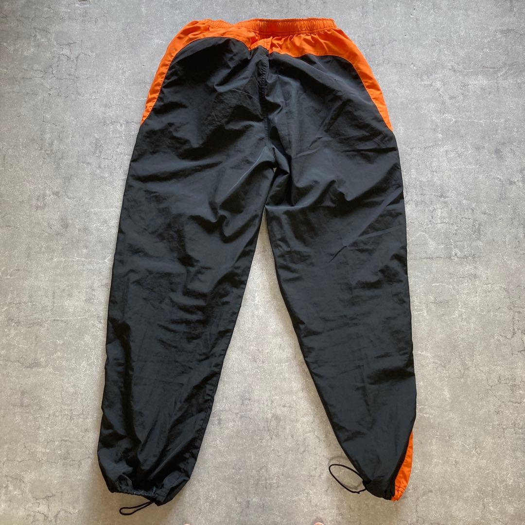 ATHLETA ピステ上下 セットアップ　オレンジ/ブラック　Lサイズ