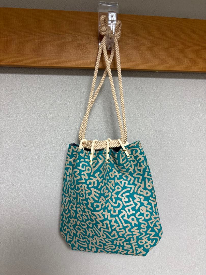 新品　印傳屋キースヘリング　合切袋（中）マチ付　巾着袋　グリーン