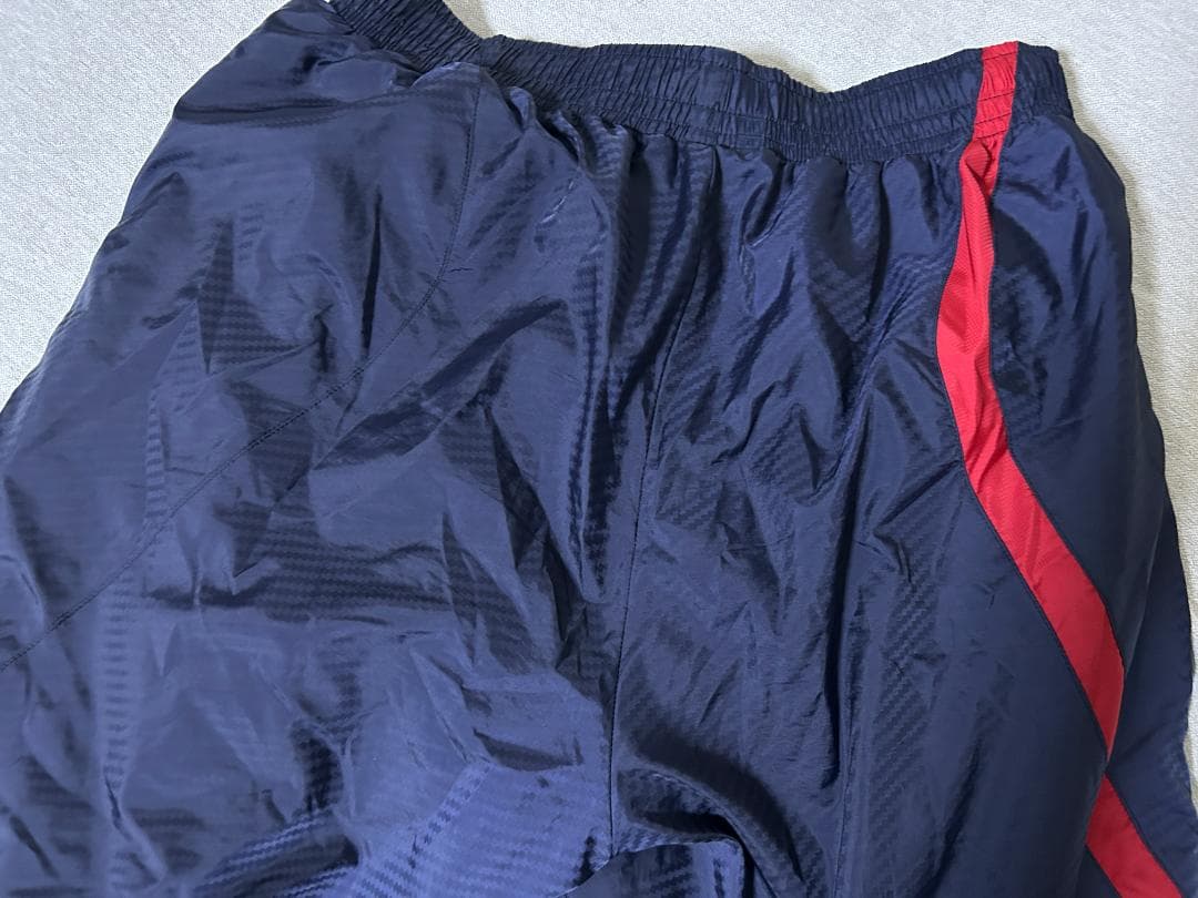 サイズ違い上下アシックス中綿入りウオームアップジャケットパンツ